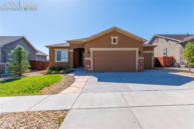 ranch-style home featuring a garage