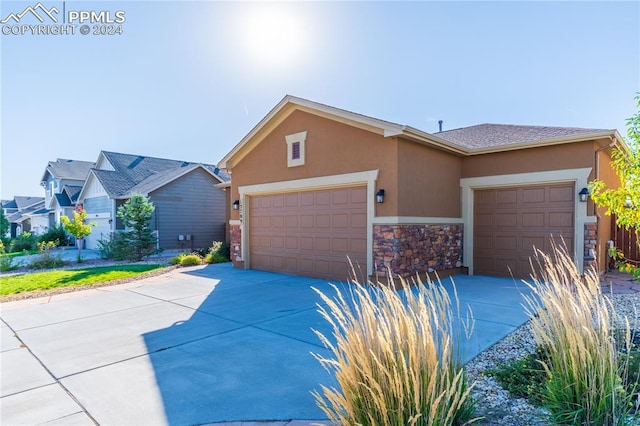 single story home featuring a garage