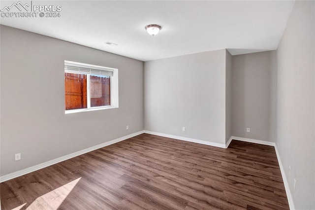 empty room with wood-type flooring