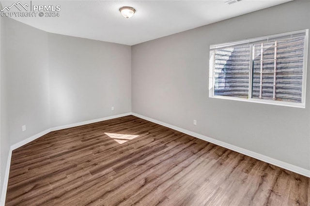 spare room featuring hardwood / wood-style flooring