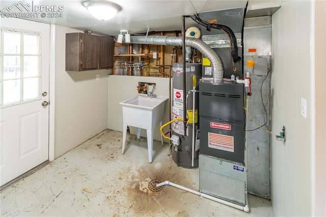 utility room with water heater