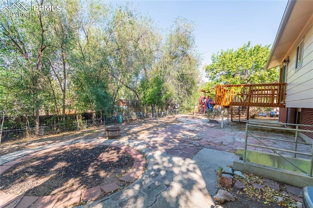 view of yard with a patio area and a deck