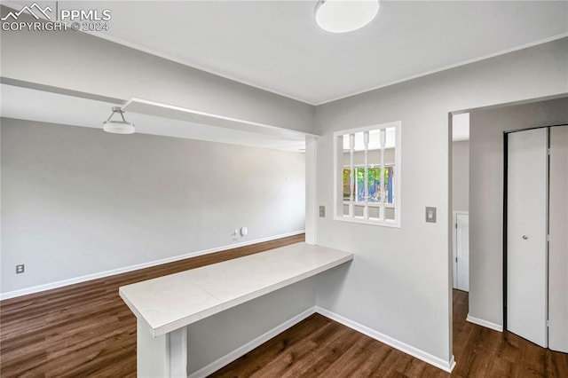 hall with dark hardwood / wood-style flooring