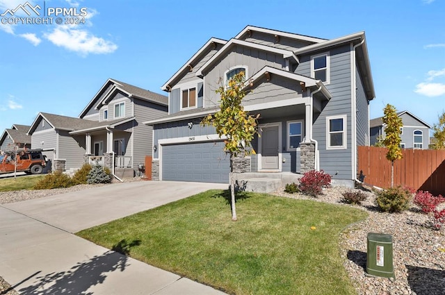 craftsman-style home with a front yard and a garage