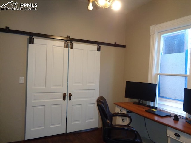 office space with plenty of natural light and dark hardwood / wood-style flooring