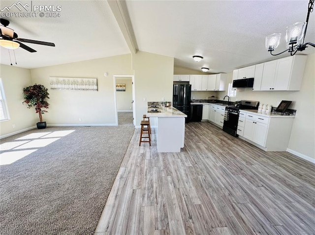 kitchen featuring a kitchen breakfast bar, lofted ceiling with beams, white cabinets, ventilation hood, and black appliances