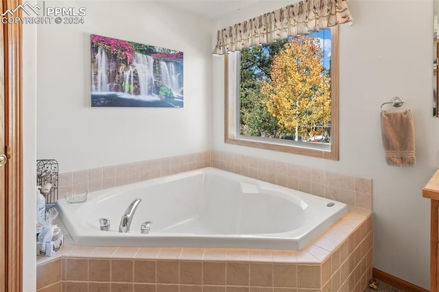 bathroom with tiled tub