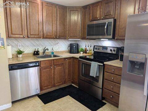 kitchen with sink, stainless steel appliances, and tasteful backsplash