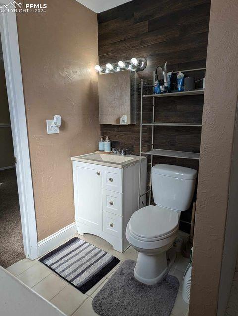 bathroom featuring vanity, toilet, and tile patterned floors