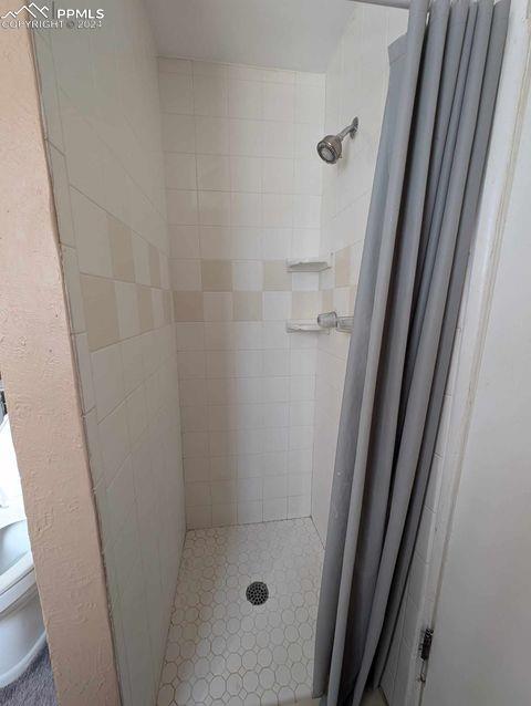 bathroom featuring walk in shower