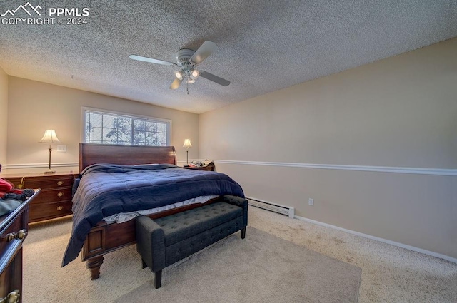 bedroom featuring a baseboard heating unit, light carpet, a textured ceiling, and ceiling fan