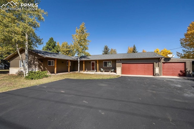 single story home with a garage