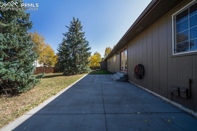 view of side of home featuring a patio area