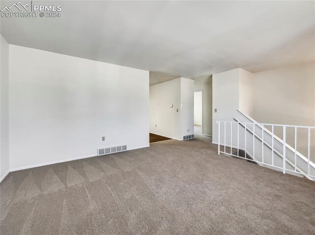 empty room featuring carpet flooring