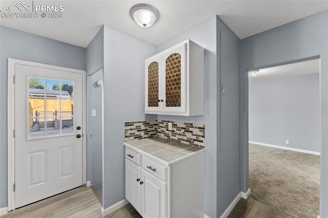 entryway with light hardwood / wood-style floors