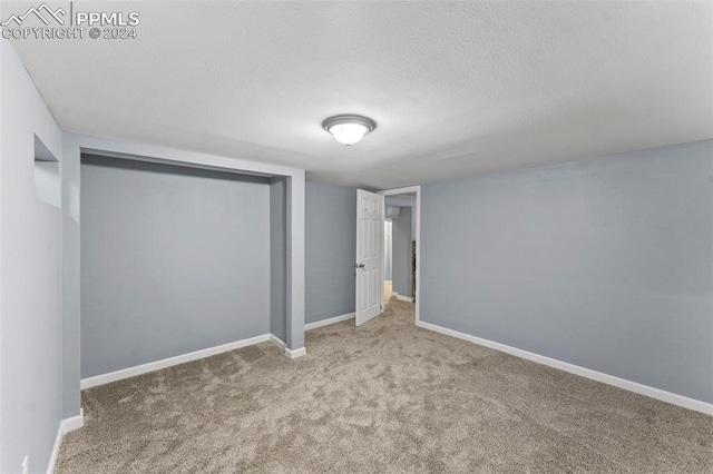 unfurnished bedroom with light carpet