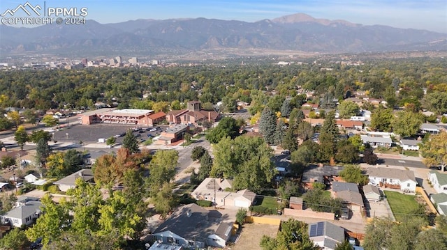 birds eye view of property featuring a mountain view