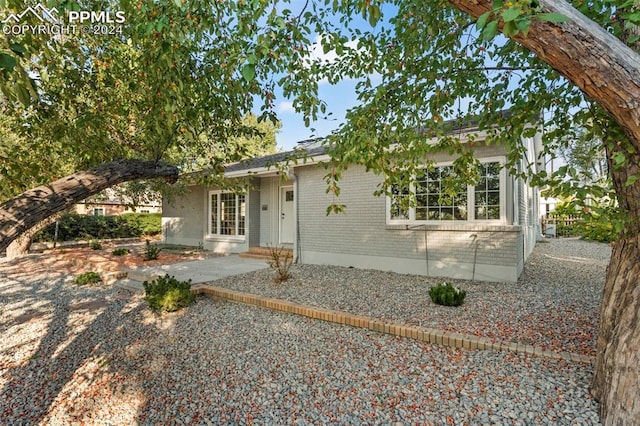 view of front of house with a patio area