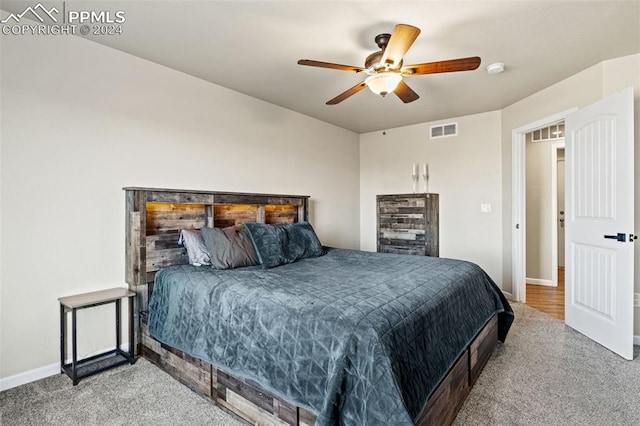 bedroom with ceiling fan and carpet