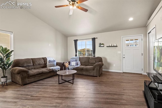 living room featuring ceiling fan, vaulted ceiling, and dark hardwood / wood-style floors