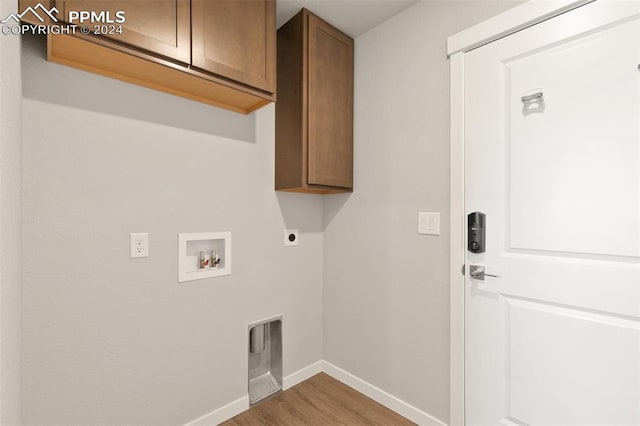 791 Little Bear Grv, Colorado Springs, CO 80907 - laundry area with washer hookup, cabinet space, baseboards, wood finished floors, and hookup for an electric dryer