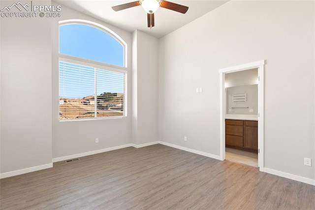 791 Little Bear Grv, Colorado Springs, CO 80907 - unfurnished bedroom featuring light wood-style floors, baseboards, connected bathroom, and a ceiling fan