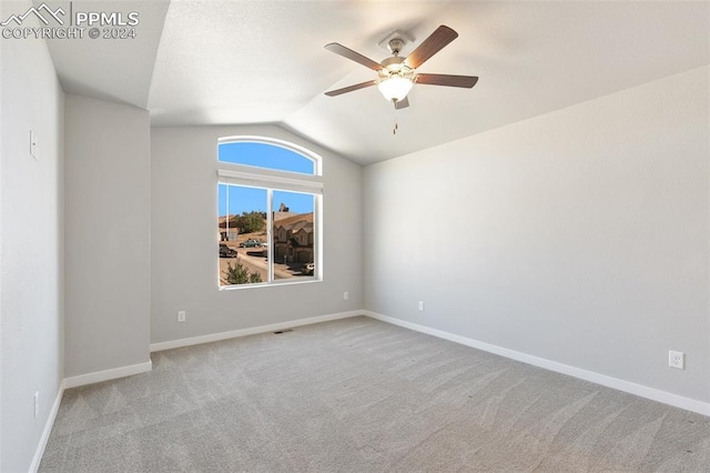 791 Little Bear Grv, Colorado Springs, CO 80907 - carpeted spare room featuring vaulted ceiling, a ceiling fan, and baseboards