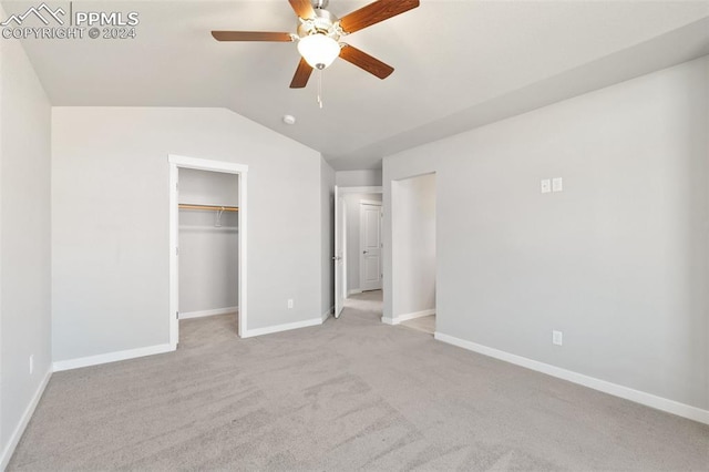 791 Little Bear Grv, Colorado Springs, CO 80907 - unfurnished bedroom featuring light carpet, lofted ceiling, baseboards, a spacious closet, and ceiling fan