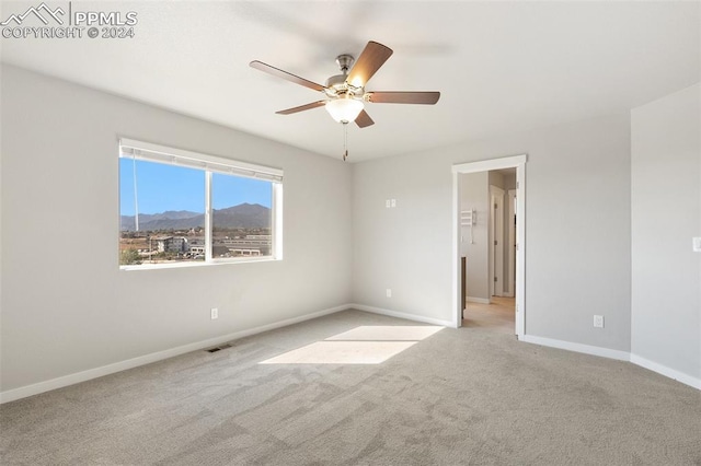 791 Little Bear Grv, Colorado Springs, CO 80907 - carpeted spare room featuring ceiling fan, baseboards, and a mountain view