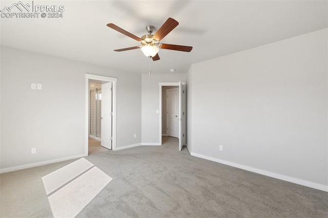 791 Little Bear Grv, Colorado Springs, CO 80907 - unfurnished bedroom with light colored carpet, baseboards, ceiling fan, and ensuite bath
