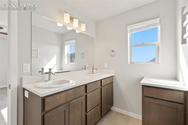 791 Little Bear Grv, Colorado Springs, CO 80907 - full bath with double vanity and baseboards