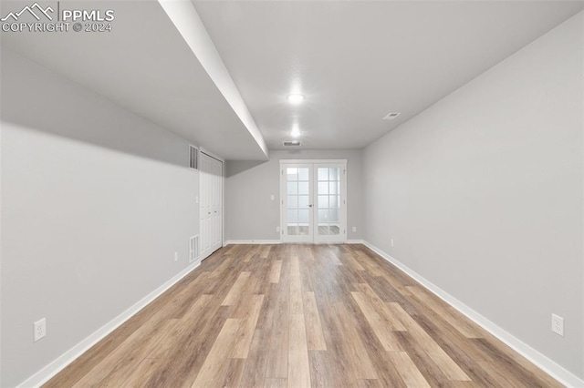 791 Little Bear Grv, Colorado Springs, CO 80907 - unfurnished room featuring french doors, light wood-style flooring, and baseboards