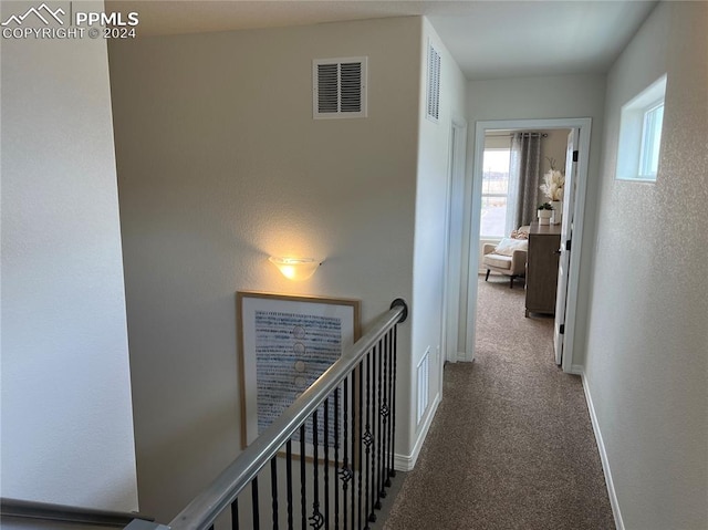 corridor featuring carpet flooring