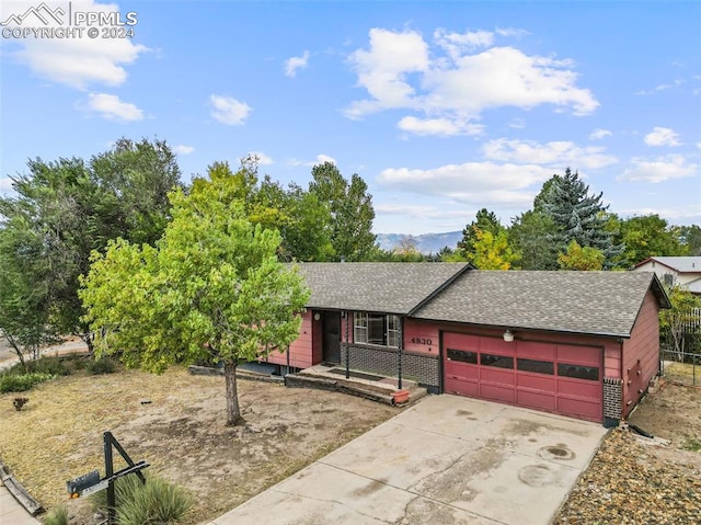 ranch-style home with a garage