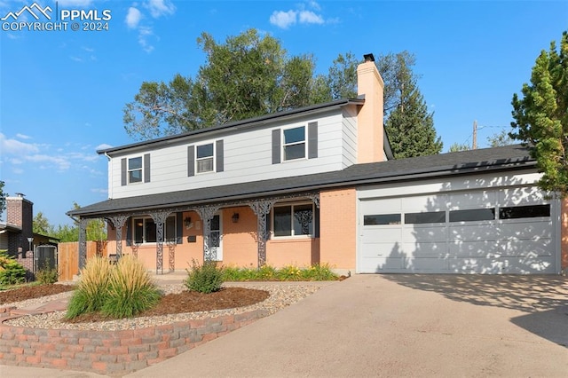 view of front of house with a garage and covered porch