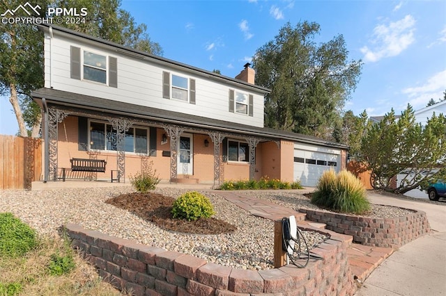 view of front of house with a garage and a porch