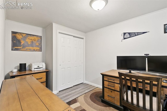 office area featuring crown molding and dark hardwood / wood-style floors