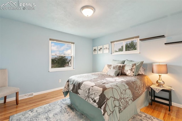 bedroom with light hardwood / wood-style floors