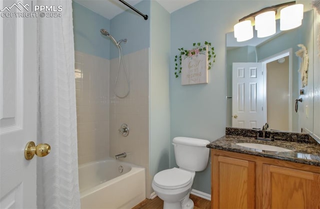 full bathroom with vanity, shower / bath combo with shower curtain, toilet, and wood-type flooring