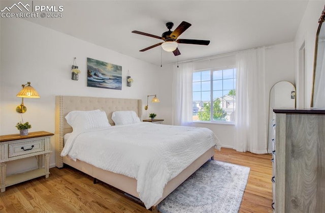 bedroom featuring ceiling fan and light hardwood / wood-style floors