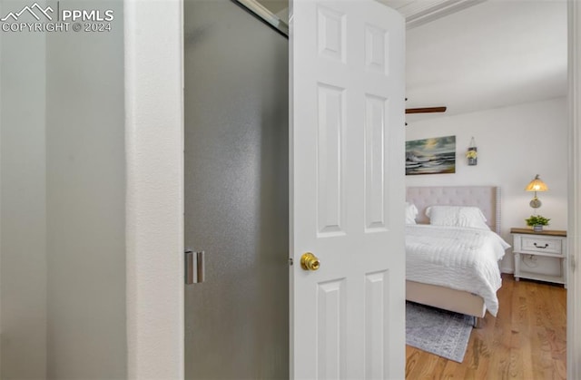 bedroom featuring hardwood / wood-style floors and ceiling fan