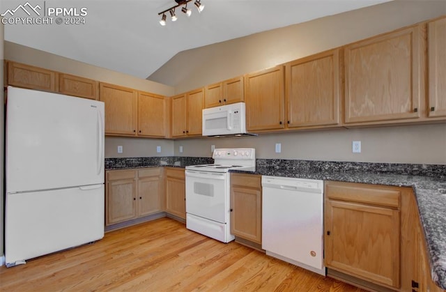 kitchen featuring light wood-type flooring, white appliances, vaulted ceiling, and light brown cabinets