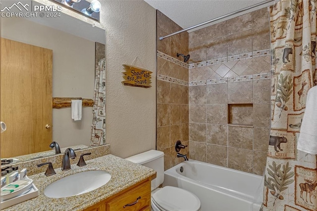 full bathroom featuring vanity, toilet, shower / bathtub combination with curtain, and a textured ceiling