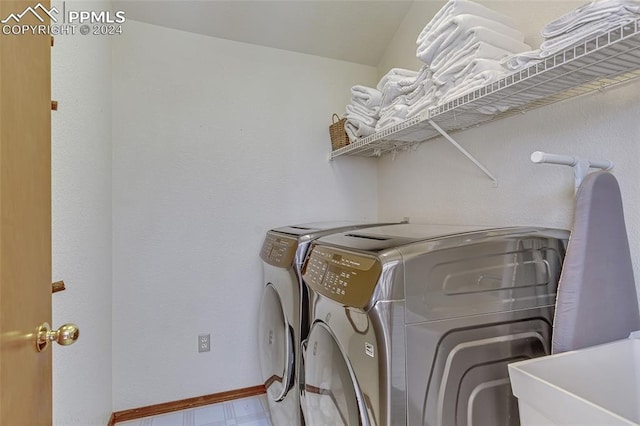 2601 Vista Glen Ct, Woodland Park, CO 80863 - clothes washing area with washer and clothes dryer, laundry area, and baseboards