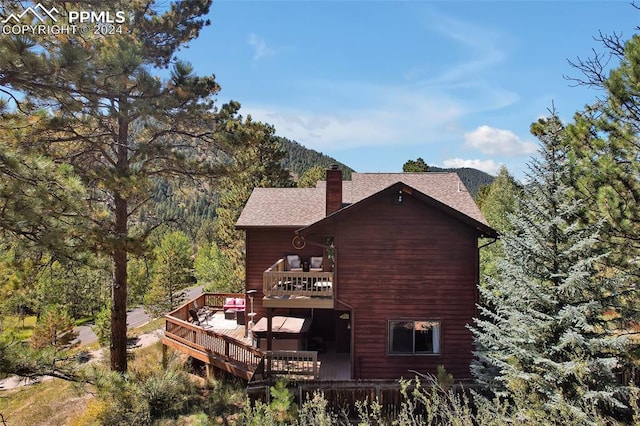 view of property exterior featuring a deck