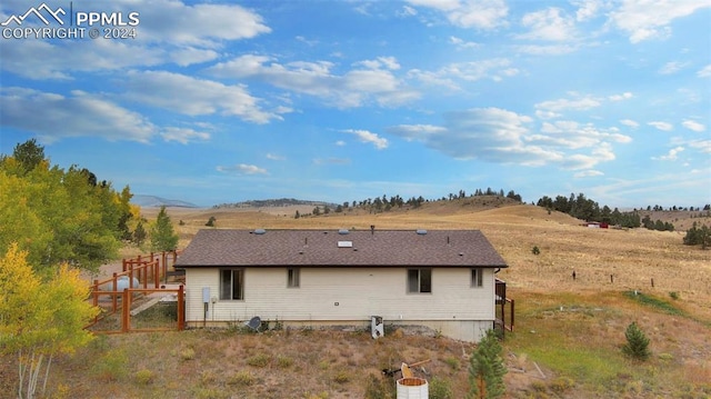 rear view of house with a mountain view