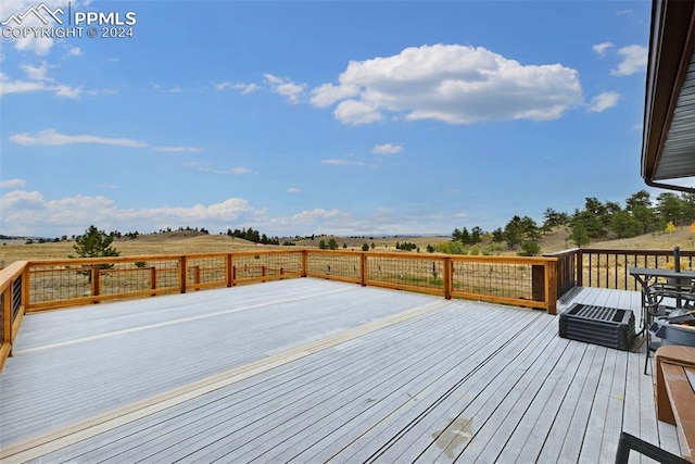 wooden terrace with a rural view