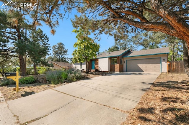 ranch-style house featuring a garage