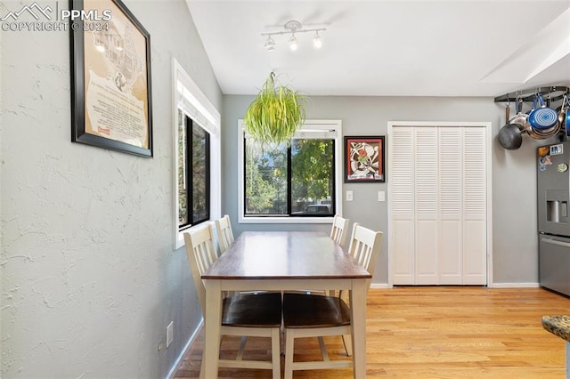 dining area featuring light wood-type flooring