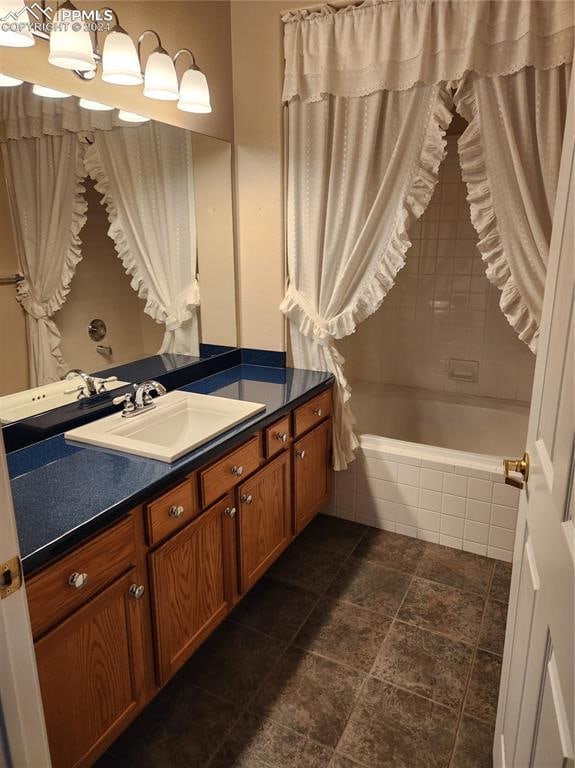 bathroom with vanity and shower / bath combination with curtain